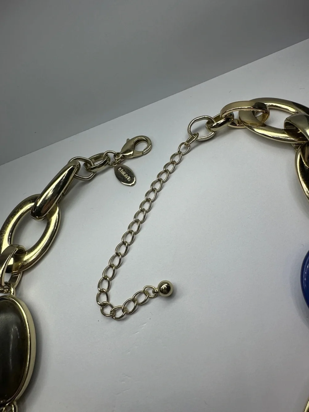 Chico's Gold-Tone Link Necklace with Deep Blue Swirled Lucite Rings - Picture 4 of 5